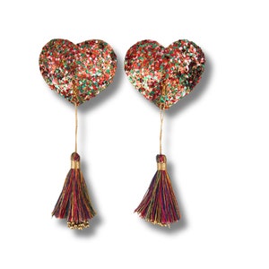 Cubrepezones JUBILEE con forma de círculo o corazón con purpurina multicolor (2 unidades) y borlas extraíbles para lencería, carnaval, burlesque y rave.
