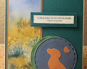 A dog wags it's tail with it's heart sympathy card