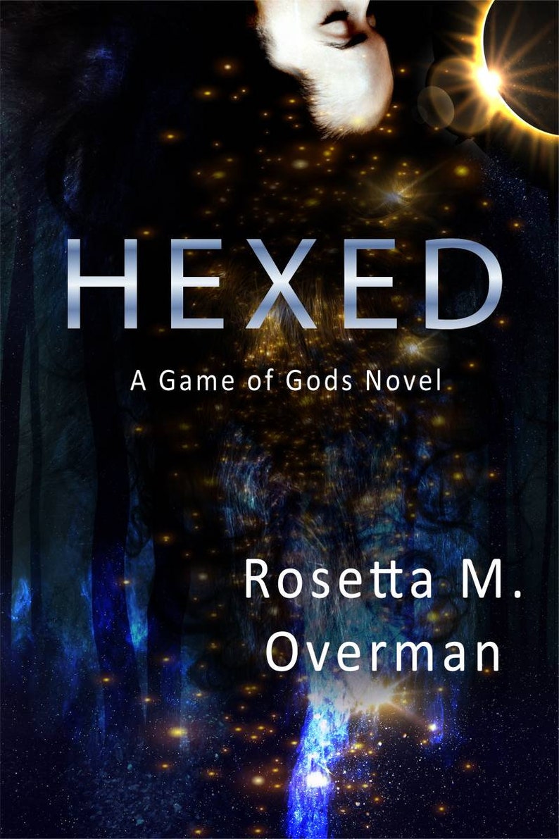May include: Book cover for "Hexed: A Game of Gods Novel" by Rosetta M. Overman. The cover features a dark, cosmic background with the title in silver, a partial face, and a celestial design.