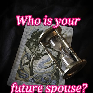 May include: An antique brass hourglass rests on a tarot card with a skeleton illustration. The card is labeled "The Trumpe" and the text "Who is your future spouse?" is written in pink.