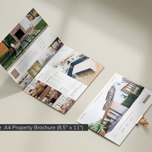 May include: A landscape A4 property brochure (8.5" x 11") with images of homes and interiors. The brochure is open, displaying multiple pages with text and photos. A separate page is also visible, held by a gold paper clip. The text "It is well" is at the top.