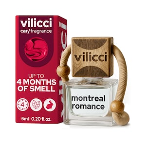 May include: A car air freshener with a clear, square bottle and a wooden top. The bottle has the text "montreal romance" and is attached to a red box with the brand name "vilicci". The box also states "Up to 4 months of smell".