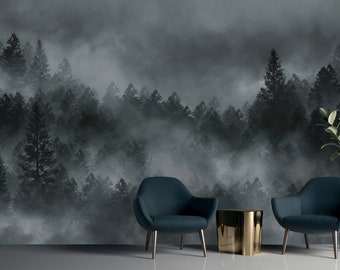 May include: An interior scene with a forest mural backdrop, creating a misty atmosphere. Two teal armchairs with gold legs are positioned near a gold side table. A potted plant in a gold and black stand adds a touch of greenery. The design is modern and stylish.