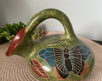 Nicaraguan handpainted clay pottery jug with handle- monkey and butterfly design