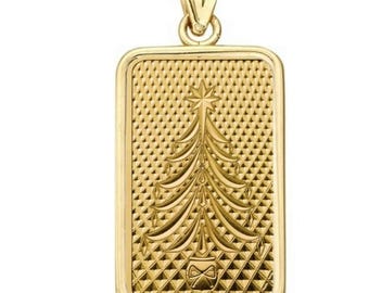May include: A gold-colored rectangular pendant with a Christmas tree design. The pendant features a textured background and a detailed tree with a star on top. The bail is also gold-colored.