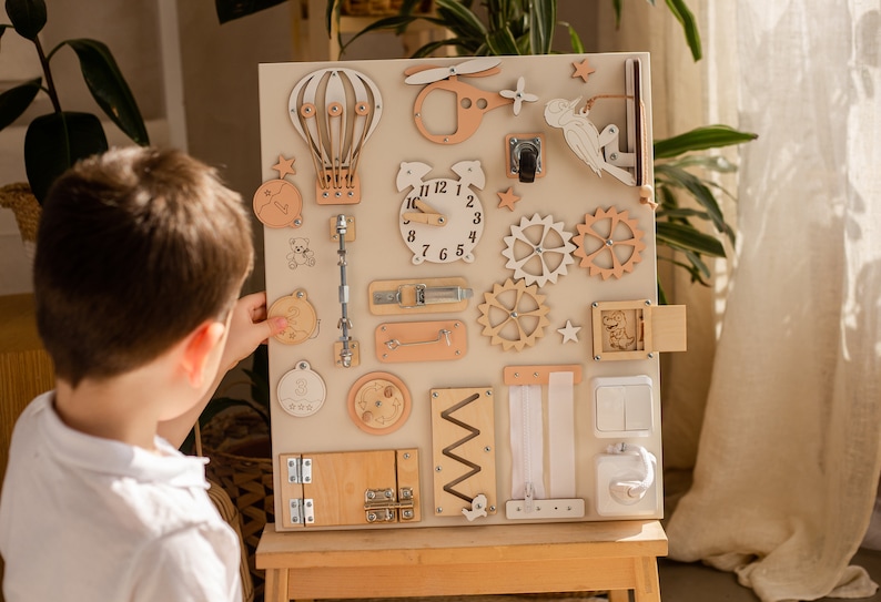 Delve into the world of our Extra Large Montessori Sensory Board, the ultimate 1st Birthday Gift! This Busy Board engages toddlers in interactive play, promoting developmental milestones. Invest in educational fun that enhances motor skills