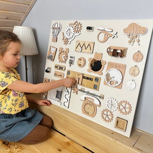 Delve into the world of our Extra Large Montessori Sensory Board, the ultimate 1st Birthday Gift! This Busy Board engages toddlers in interactive play, promoting developmental milestones. Invest in educational fun that enhances motor skills