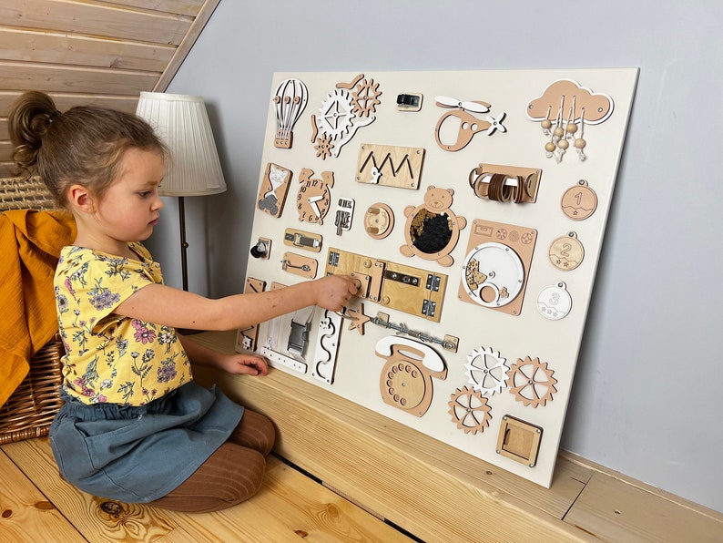 Delve into the world of our Extra Large Montessori Sensory Board, the ultimate 1st Birthday Gift! This Busy Board engages toddlers in interactive play, promoting developmental milestones. Invest in educational fun that enhances motor skills