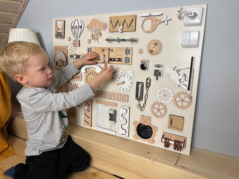 Explore our Extra Large Montessori Sensory Board, a perfect 1st Birthday Gift! This Busy Board for babies fosters development with interactive activities. Invest in educational play, motor skills, and endless fun. Ideal for curious toddlers!