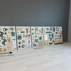 May include: Four wooden activity boards, each 40 cm wide and 60 cm tall, displayed together. They feature interactive elements such as gears, clocks, and shapes in blue, beige, and natural wood tones, designed for educational play.