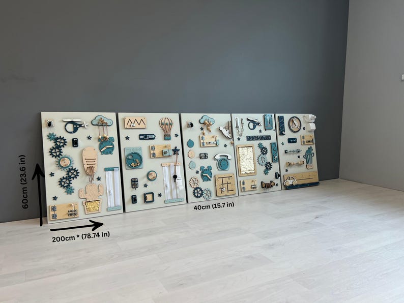 May include: Four wooden activity boards, each 40 cm wide and 60 cm tall, displayed together. They feature interactive elements such as gears, clocks, and shapes in blue, beige, and natural wood tones, designed for educational play.