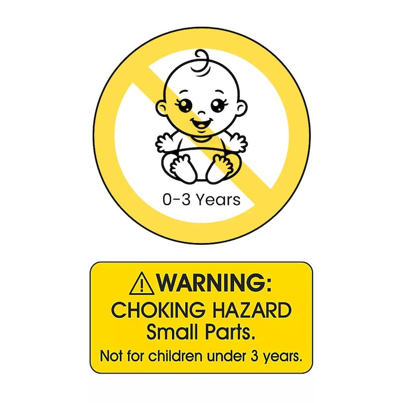K&ouml;nnte beinhalten: Ein gelbes, kreisf&ouml;rmiges Sicherheitsschild mit einem schwarzen Baby-Symbol, das durchgestrichen ist, und dem Text 0-3 Years, &uuml;ber einem gelben rechteckigen Schild mit dem Text WARNING: CHOKING HAZARD Small Parts. Not for children under 3 years.