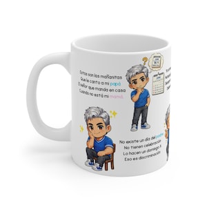 May include: A white ceramic mug featuring cartoon illustrations of a person with silver hair wearing a blue shirt and dark trousers. The mug includes Spanish text, a calendar graphic marked June 16th for Father's Day, and yellow star accents.
