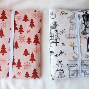 Decorative padded and elasticated pocket cover for e-reader