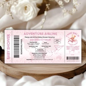 May include: A pink baby shower invitation designed as a boarding pass from Adventure Airline. The invitation includes details for Samantha Patterson's baby shower, with a teddy bear graphic and the text "A Baby Girl is Landing Soon."
