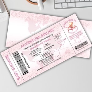 May include: Pink baby shower invitation designed as an airline boarding pass. The invitation includes text such as "Adventure Airline" and "Baby Girl is Landing Soon." The invitation features a world map design and a teddy bear illustration.
