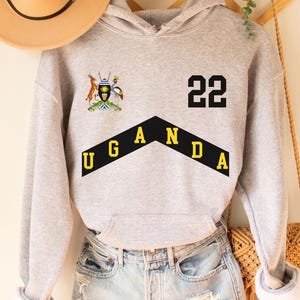 Moletom com capuz Uganda, camisa Uganda, futebol Uganda, camiseta de lembrança Uganda, viagem Uganda, camiseta de férias Uganda, camiseta Uganda, camiseta Uganda