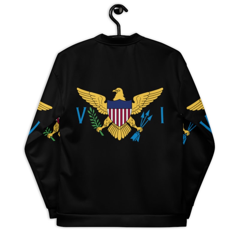 May include: Black bomber jacket with the flag of the United States Virgin Islands printed on the back. The flag features a golden eagle with a shield, a green wreath, and three blue arrows.