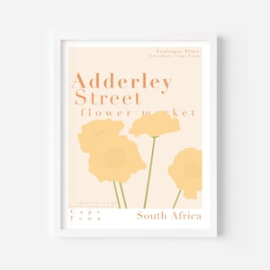 Może przedstawiać: Plakat z brzoskwiniowym tłem i stylizowanymi żółtymi kwiatami. Tekst głosi "Adderley Street flower market" i "Trafalgar Place, Foreshore, Kapsztad, Republika Południowej Afryki".