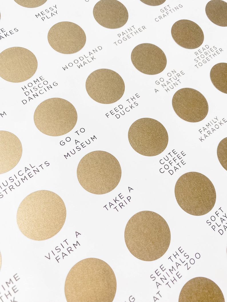 May include: A gold-colored chart with a list of activities to do with family and friends. The chart is divided into circles with text inside each circle. Some of the activities include "Go to a Museum", "Feed the Ducks", "Take a Trip", "Visit a Farm", "See the Animals at the Zoo", "Cute Coffee Date", "Family Karaoke", "Soft Play Date", "Read Stories Together", "Go on a Nature Hunt", "Paint Together", "Get Crafting", "Messy Play", "Home Disco Dancing", "Woodland Walk", and "Musical Instruments".