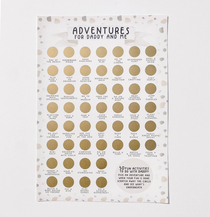 May include: A white card with gold circles and black text. The card has a title that says "Adventures for Daddy and Me". The card has a list of 50 fun activities to do with your dad.  The card says "Pick an adventure and when your fun is done scratch away the circle and see what's underneath."