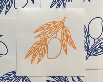 May include: A print of a single orange mango branch with leaves and a mango fruit on a white background. The print is surrounded by blue and white prints of mango branches with leaves and fruit.