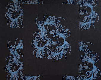 May include: A black background with a repeating pattern of blue stylized floral designs. The design is a stylized fern or leaf pattern.