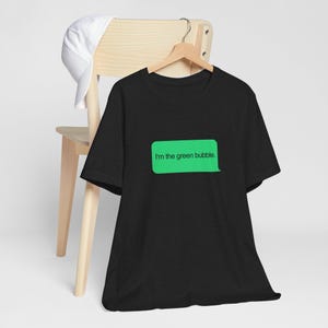 May include: Black t-shirt with a green text bubble that says "I'm the green bubble."
