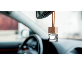 Refillable car air freshener with new car fragrance diffuser with essential oils.