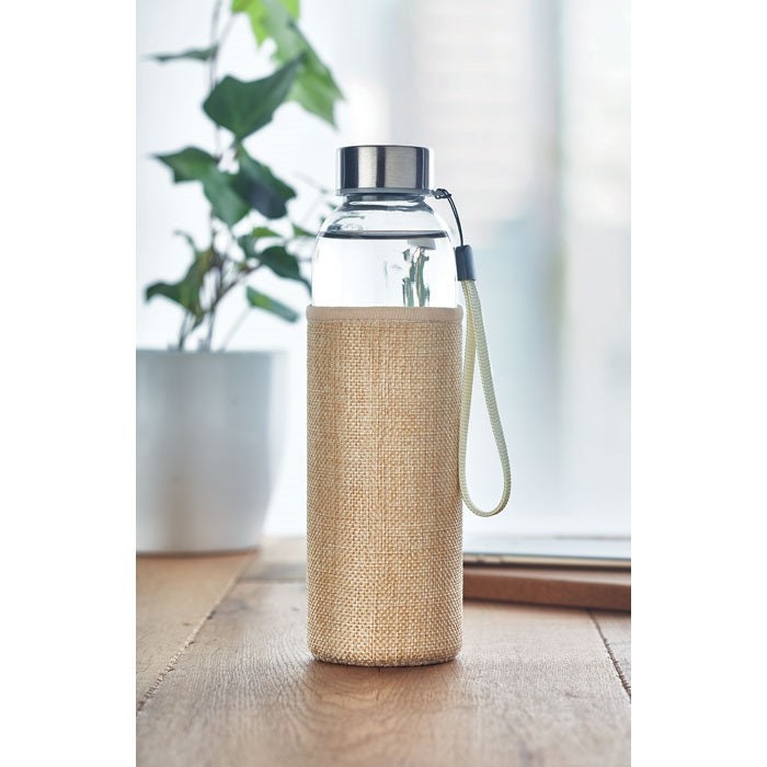 Reusable glass bottle with material pouch
