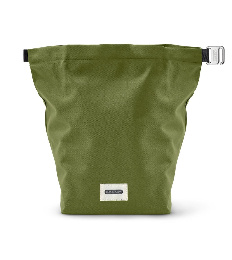 May include: A green canvas drawstring bag with a black strap and a small white label that says "Black+Blum".