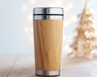 Double Walled stainless steel flask with bamboo cover and PP lid.