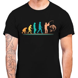 May include: Black t-shirt featuring a graphic of the evolution of man, culminating in a man fishing. The graphic is in shades of blue, green, orange, and yellow.