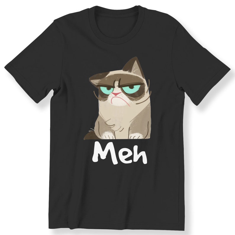 May include: Black t-shirt featuring a cartoon image of a grumpy cat with the word "Meh" printed below it.