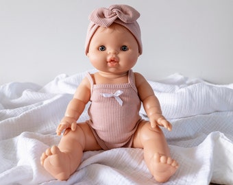 Goldie | Baby Girl with Blonde Hair Blue eyes and Blush Romper and Headband