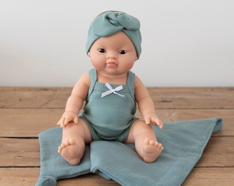 Ellie | Baby Girl with Brown Hair Brown eyes and Lagoon Romper and Headband