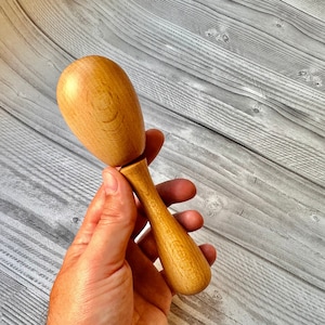 Darning egg with handle for darning socks and visible mending