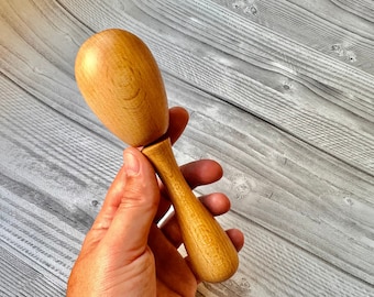 Darning egg with handle for darning socks and visible mending