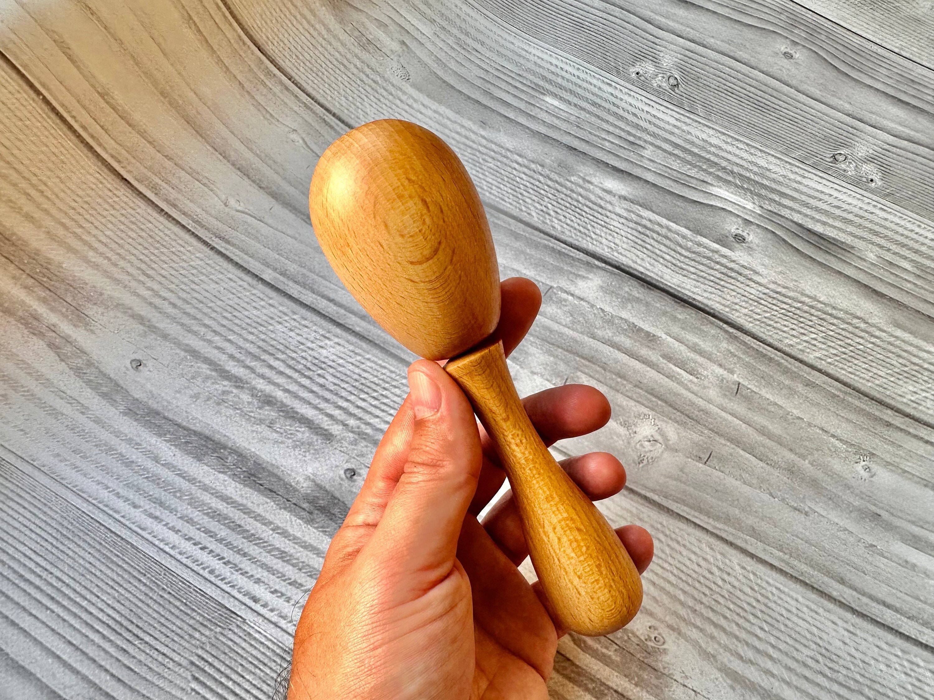 Darning egg with handle for darning socks and visible mending