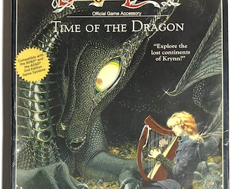 May include: A box for the Dungeons & Dragons game Dragonlance: Time of the Dragon. The box features a black dragon with a yellow eye and a woman playing a harp. The text on the box reads "Advanced Dungeons & Dragons 2nd Edition Dragonlance Official Game Accessory Time of the Dragon Explore the lost continents of Krynn!"