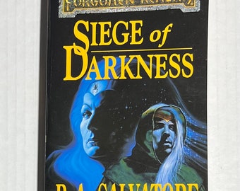 May include: A book cover with a black background and a yellow title that reads "Siege of Darkness". The book is part of the Forgotten Realms series and is written by R.A. Salvatore. The cover features a woman with blue hair and a man with white hair.