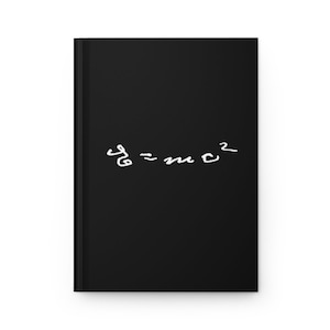 May include: A black notebook with the equation "E=mc^2" written in white on the front cover.