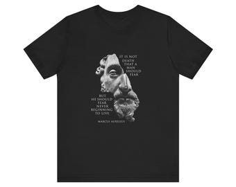 May include: Black t-shirt with a white image of a bust of a man and a quote from Marcus Aurelius that reads: "It is not death that a man should fear, but he should fear never beginning to live."