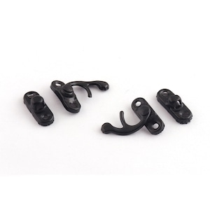 May include: Four black plastic clasps for sewing or crafting projects. The clasps have a hook and loop design.
