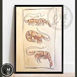 May include: A framed watercolour print showing three detailed illustrations of shrimp. The shrimp are depicted in shades of brown and red, with delicate lines and shading. The artwork is set against a cream-coloured background.