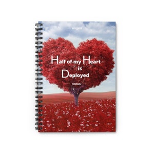 May include: A red spiral bound journal with a heart-shaped tree on the cover. The tree is red and has the words "Half of my Heart is Deployed" written on it. The journal is titled "Journal".