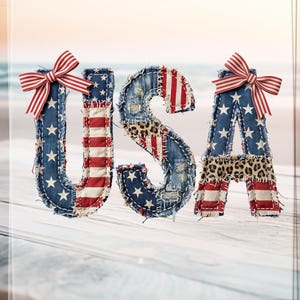 May include: The letters U, S, and A are crafted with a patchwork design featuring blue fabric with white stars, red and white stripes, and leopard print accents. The letters U and A are each adorned with a red and white striped fabric bow.
