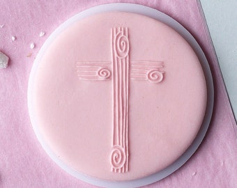 A wooden cross embosser, cookie biscuit stamp, cake decorating, fondant icing.