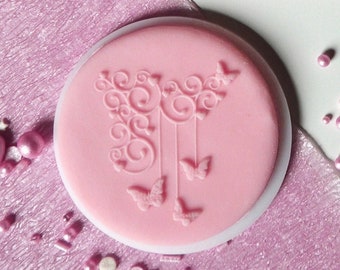 Classy butterflies in ornaments embosser, cookie biscuit stamp, cake decorating, fondant icing.