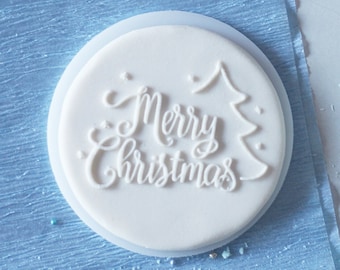 Merry christmas with christmas tree embosser, cookie biscuit stamp, cake decorating, fondant icing.